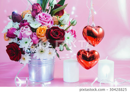 Vase of bouquet Roses, red heart and white candle 30428825