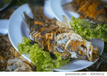 Fried fish on plate , selective focus Fried fish on plate , selective focus 30430232