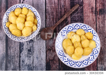 Mini green mango compote in Thai pattern plate. 30430394