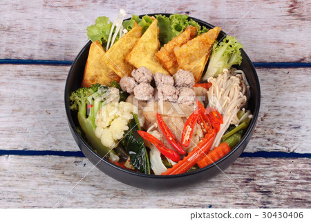 Crisy wonton and meat ball in Chinese kale soup . 30430406