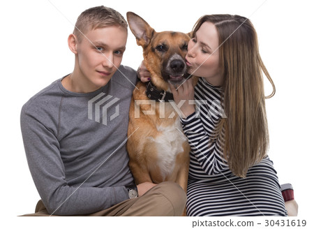 Young family and their pet shepherd 30431619