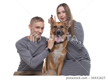 Young family and their dog 30431627