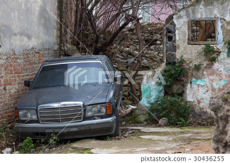 Abandoned car and ruined walls Abandoned car and ruined walls 30436255