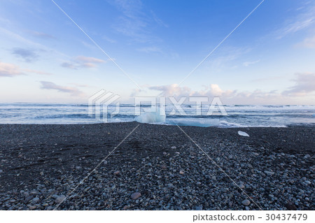 Black rock and sand beach coastline 30437479
