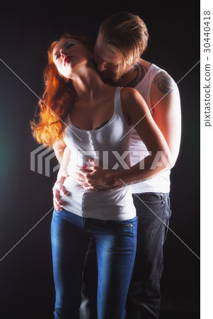Sexy couple hugging and kissing Sexy couple hugging and kissing 30440418