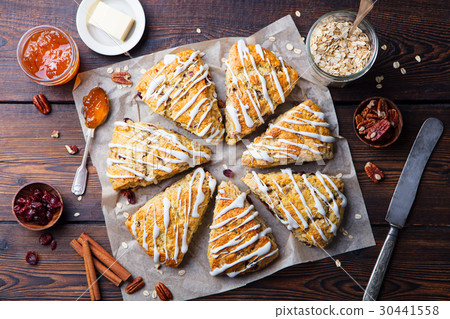 Scones with oats, cranberry, pecan nuts. Top view 30441558