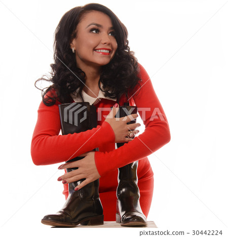 Young slim woman with boots on white background. 30442224
