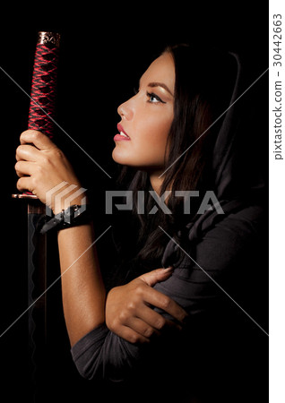 young woman  holding samurai sword. 30442663