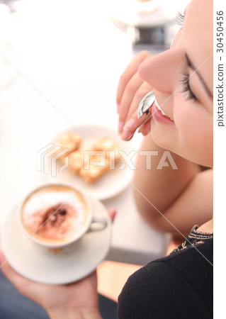 Portrait of a brunette woman during the coffee break 30450456