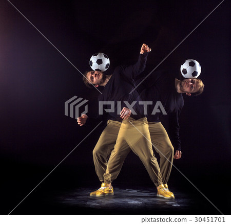 A portrait of a fan with ball on gray studio A portrait of a fan with ball on gray studio 30451701