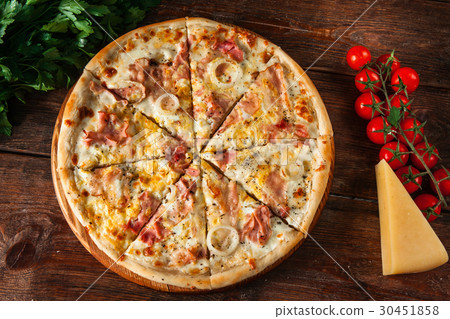 Delicious pizza with bacon on rustic wooden table Delicious pizza with bacon on rustic wooden table 30451858