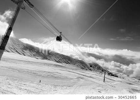 Black and white view on gondola lift and ski slope 30452665