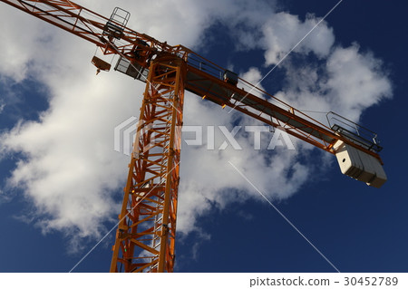 Construction site crane which shines in blue sky Construction site crane which shines in blue sky 30452789