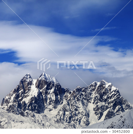 Mounts Ushba and Chatyn and blue sky with clouds 30452800