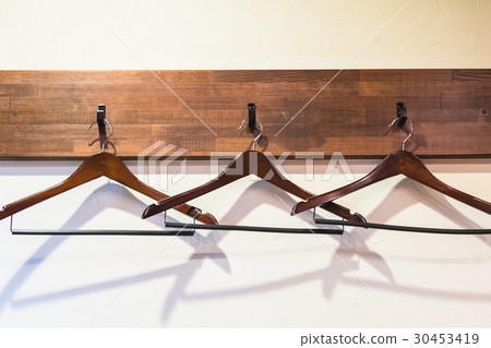 wooden hangers hanging on the hook wooden hangers hanging on the hook 30453419