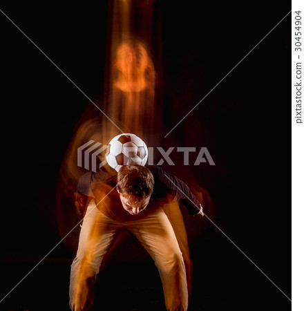 A portrait of a fan with ball on gray studio 30454904