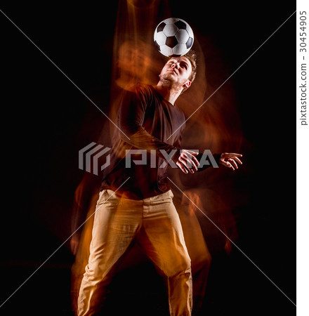 A portrait of a fan with ball on gray studio 30454905