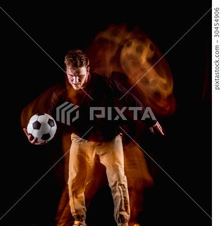 A portrait of a fan with ball on gray studio 30454906