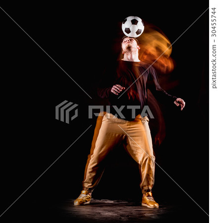 A portrait of a fan with ball on gray studio A portrait of a fan with ball on gray studio 30455744
