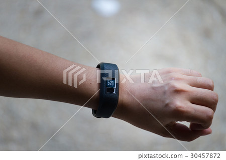 Young women wears smart watch 30457872