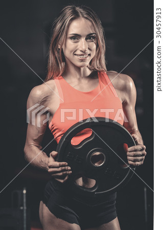 Sexy portrait model and tanned body looking away in gym .. Sexy portrait model and tanned body looking away in gym .. 30457913