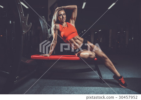 Fitness sexy mode on diet with long female legs gym. 30457952