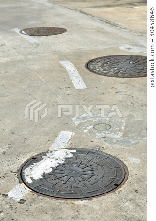 Manhole cover on street, drain cover 30458646