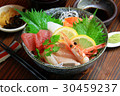 Bowl of rice topped with sashimi  30459237