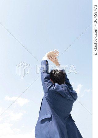 Young man and blue sky behind the stomach 30459472
