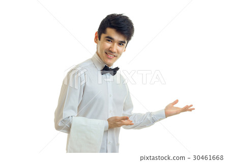 young attractive waiter keeps on hand towel and 30461668