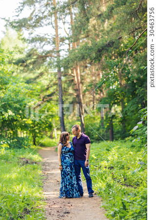 Caucasian pregnant woman and her husband outdoors 30463756