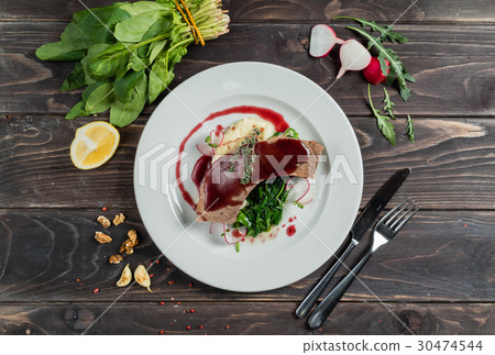 grilled beef tongue with fried spinach and red wine sauce 30474544