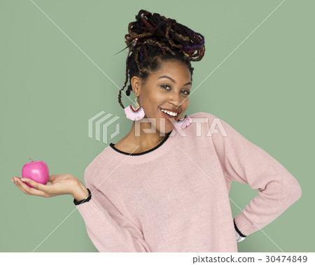 African Woman Holding Pink Apple with a Smile 30474849
