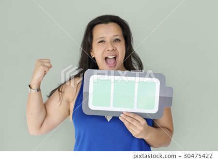 A powerful woman holding full charging battery A powerful woman holding full charging battery 30475422