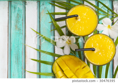 Mango smoothie, juice and fresh mango. Top view. 30476395