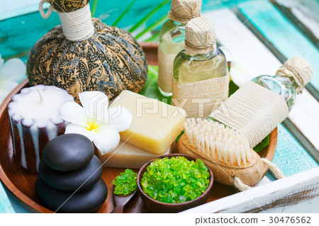 Spa and wellness massage setting, candle, stones. 30476562