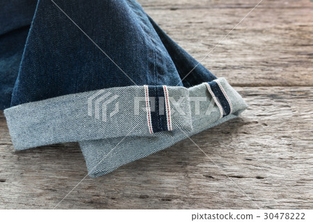 close up of fold hem red selvedge japan denim close up of fold hem red selvedge japan denim 30478222