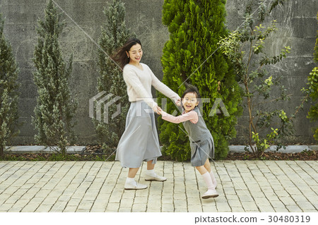 Mother and daughter playing Mother and daughter playing 30480319