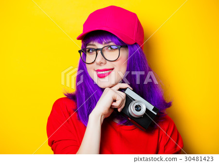 young woman with retro camera young woman with retro camera 30481423