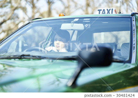Taxi female driver driving Taxi female driver driving 30481424