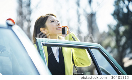 Business phone calling a smartphone call taxi 30481513