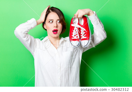 young woman with gumshoes 30482312