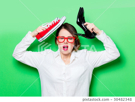 young woman with shoes and gumshoes 30482348