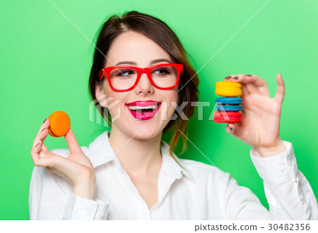 young woman with macaroons young woman with macaroons 30482356
