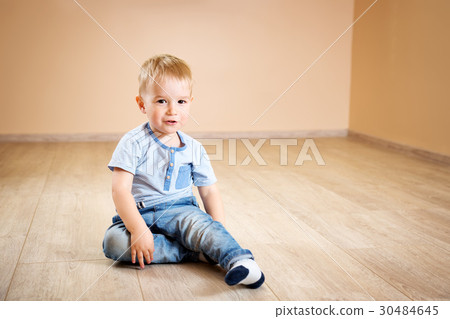 Portrait of a two years old child sitting on the Portrait of a two years old child sitting on the 30484645