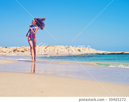 Beautiful happy slender woman at sea 30485272