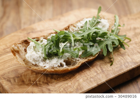 arugula on rustic bread with ricotta cheese arugula on rustic bread with ricotta cheese 30489016