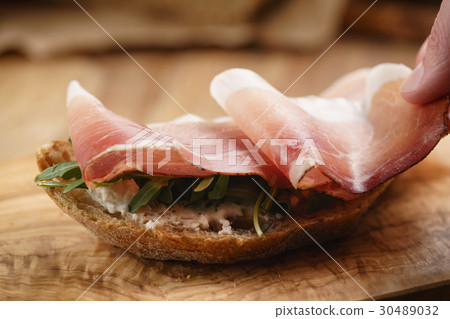 italian sandwich with speck and arugula salad 30489032