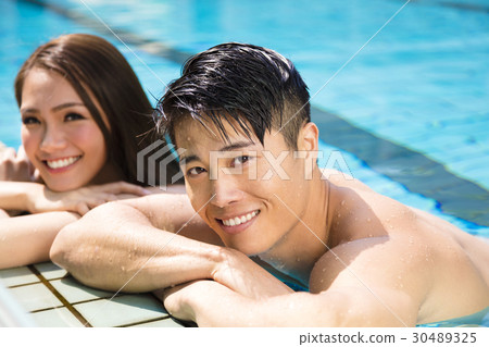 young Couple having fun in swimming pool. 30489325