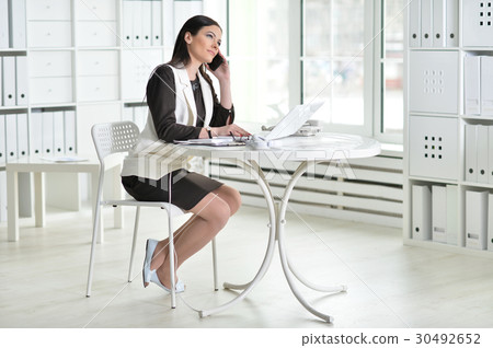 Nice business woman sitting  with laptop 30492652